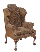 A tapestry upholstered wing back armchair in George I style  A tapestry upholstered wing back