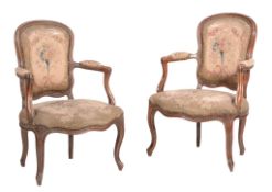 A pair of Louis XV stained beech and tapestry upholstered fauteuil, circa 1760  A pair of Louis XV
