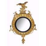 A Regency giltwood and composition convex girandole wall mirror, circa 1815  A Regency giltwood