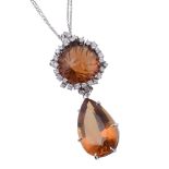 A citrine and diamond pendant, the pendant with circular cabochon citrine...  A citrine and