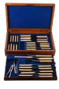 An oak cased set of stainless steel knives by Mappin Brothers  An oak cased set of stainless steel