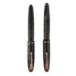 Two Parker green vacumatic pens, with a laminated emerald pearl finish  Two Parker green vacumatic
