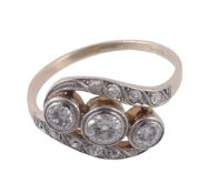 A diamond ring, set with three old brilliant cut diamond collet set within a...  A diamond ring,