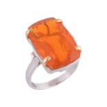 A fire opal ring, the rectangular shaped fire opal in a four claw setting  A fire opal ring,   the