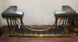 A brass and simulated leather upholstered club fender 101cm wide, 33cm deep (inside measurements)