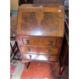 A 20th century Queen Anne style walnut bureau