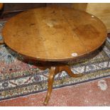 A19th century oak tilt top table on a pedestal tripod base.92cm diam