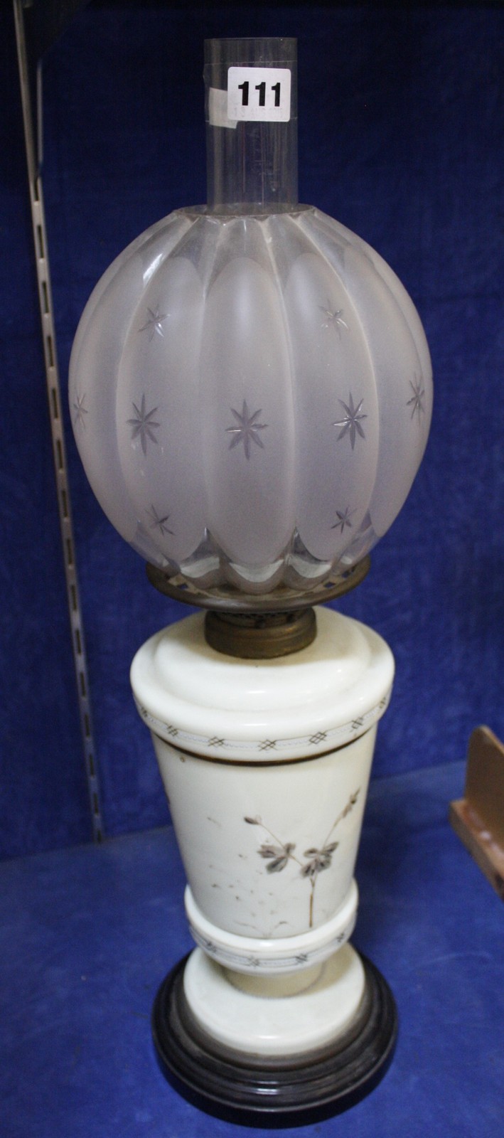 A pale green opaline glass and brass oil lamp with gourd shaped shade, 58cm high