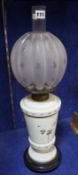 A pale green opaline glass and brass oil lamp with gourd shaped shade, 58cm high