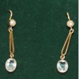 A pair of early 20th Century gold coloured, pearl and aquamarine earrings in Joseph Bonnar fitted