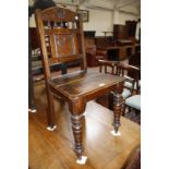 A 19th Century oak side chair and a 19th Century oak side chair, with floral carved and spindle