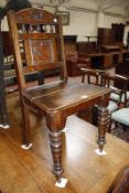 A 19th Century oak side chair and a 19th Century oak side chair, with floral carved and spindle