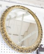 A modern oval gilt framed mirror 70cm high, 58cm wide  Best Bid