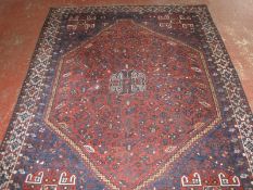 A Persian Qashqai carpet 314 x 221cm
