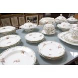 A Coalport part dinner service, floral spray decorated, comprising of tureens, serving dishes,