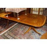 A mahogany twin pedestal extending dining table in George III style, 20th Century 247cm extended