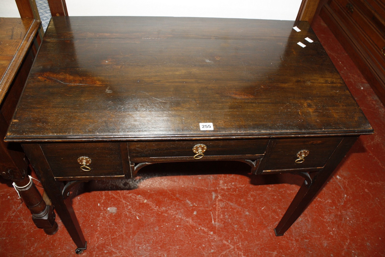 An early 20th century mahogany kneehole table. 90cm wide.