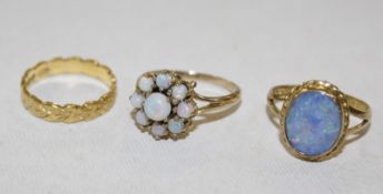 A 22ct gold ring, decorated with hearts, 3.3g approx. a 9ct gold and opal nine stone floral