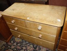 A pine chest of drawers, two drawers over two long 111cm wide x 74cm high, x 50cm deep and a pitch