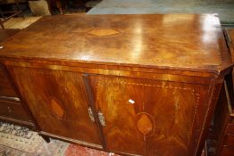 A 19th Century Dutch mahogany cabinet, with inlaid shell decoration, with hinged lid and cupboard