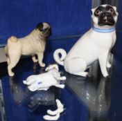 A Meissen pug (af), an early 20th Century Meissen pug and a Beswick pug (3)