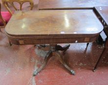 A Regency mahogany card table on a reeded column with splayed supports.100cm wide (as found).