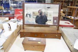 A 19th Century mahogany toilet mirror, the base with two drawers and a tea caddy (2)