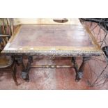 A Victorian carved oak writing table with leather top 105cm wide