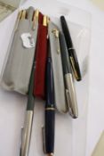 A 9ct Parker 61 fountain pen and matching 9ct Parker 61 biro, two other Parker gold coloured