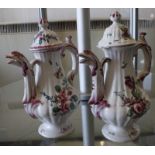 A pair of coffee pots with floral design (af), 21cm high  Best Bid