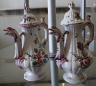A pair of coffee pots with floral design (af), 21cm high  Best Bid