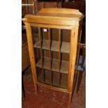 A mid 20th century light oak display cabinet. Best Bid