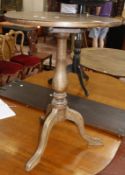 A small 19th century oak tripod table and black lacquered Japanned tripod table.