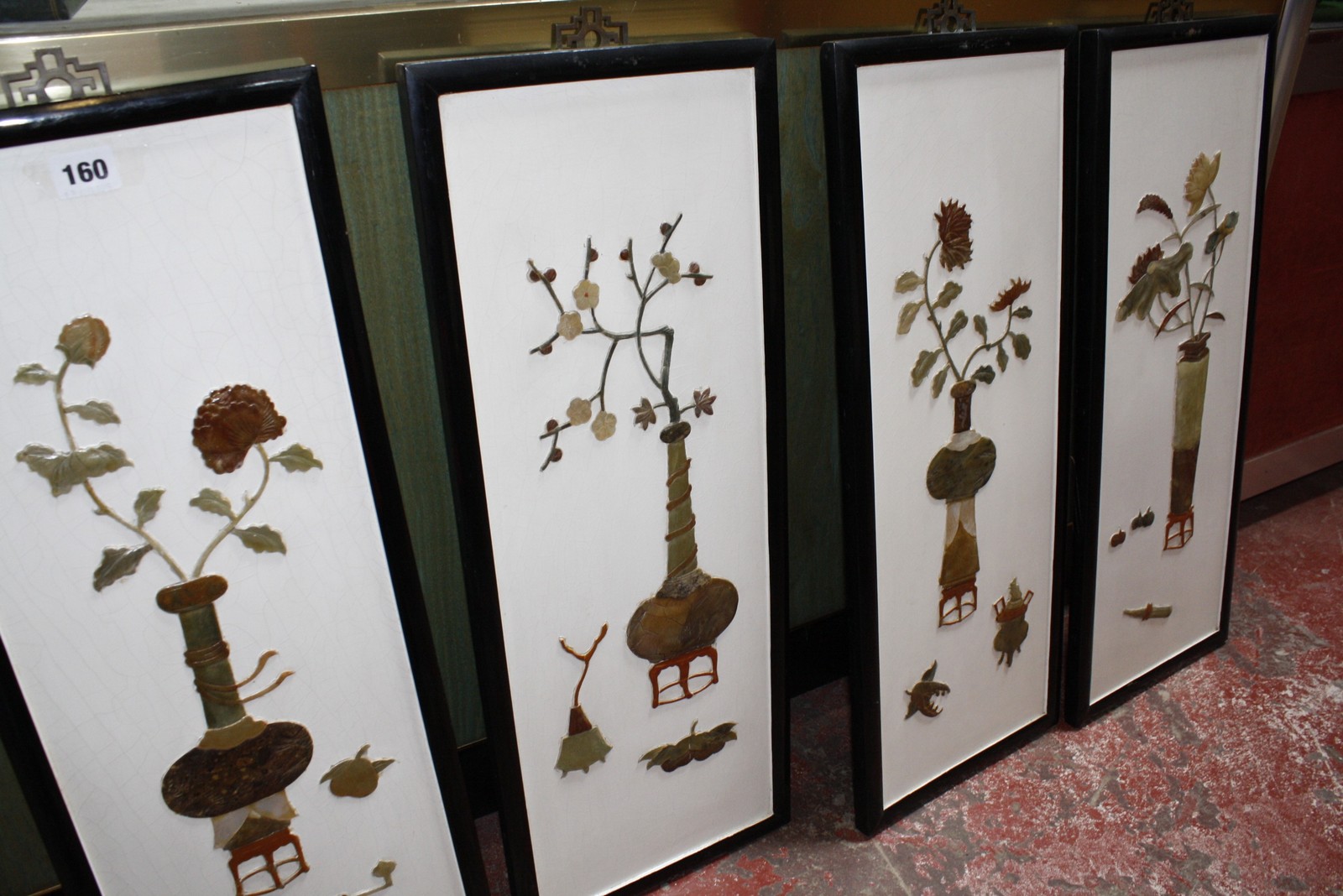 Four modern Oriental lacquered panels, floral decorated, 64cm x 25cm
