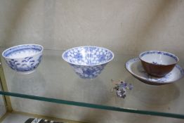 A Nanking Cargo tea bowl and saucer, a pair of blue and white tea bowls, another Chinese blue and