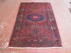 A Persian Toyserkan rug 214 x 129cm