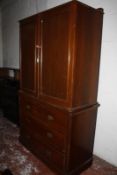 A late 19th/early 20th Century mahogany linen press, the upper doors enclosing linen slides with
