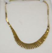 A 9ct gold graduated collar necklace, 15.9g approx. in fitted box