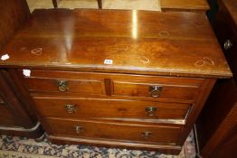 An Edwardian chest of drawers with two over two drawers. 99cm wide.