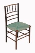 An Aesthetic period side chair, circa 1880, with spindle supports and rush seat  An Aesthetic period