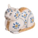 A tin-glazed earthenware cat flask, naturalistically modelled as recumbent cat  A tin-glazed