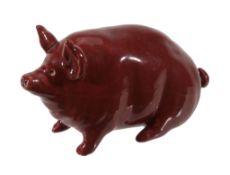 A Wemyss red piglet, circa 1900, impressed 'WEMYSS WARE R.H & S', 17cm long  A Wemyss red piglet,