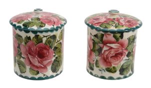 Two Wemyss large preserve jars and covers, circa 1900, painted with pink roses  Two Wemyss large