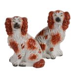 Two similar Staffordshire models of spaniels, mid 19th century  Two similar Staffordshire models