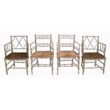 A pair of simulated bamboo armchairs in Regency style  A pair of simulated bamboo armchairs in