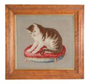 A Victorian framed and glazed needlework picture of a cat on a cushion  A Victorian framed and