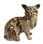 A stoneware model of a cat, circa 1900, with mottled and streaked brown  A stoneware model of a cat,