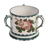 A Wemyss loving cup or tyg, circa 1900, painted with wild roses  A Wemyss loving cup or tyg, circa