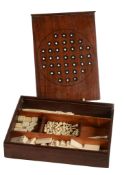 A Regency or George IV mahogany games box, circa 1820, of rectangular form  A Regency or George IV