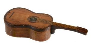 A stained and decorated olive wood box in the form of a guitar  A stained and decorated olive wood